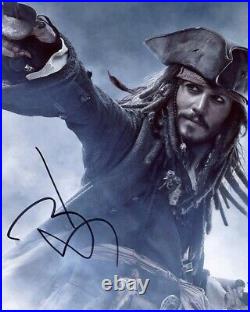 Autograph on 20 x 25 photo of johnny depp (signed in person) + video proof
